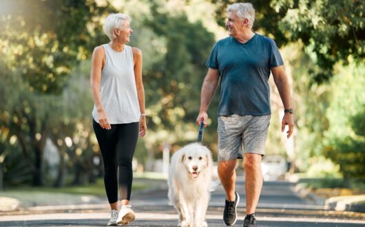 Retirement,,Fitness,And,Walking,With,Dog,And,Couple,In,Neighborhood